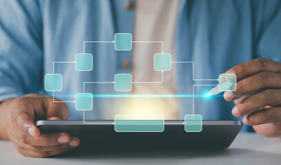 Freelancer using tablet make data flow diagram. Workflow scheduling interface. Business professional analyzing. tracking decomposition progress. manage data process system. Digital strategy dashboard