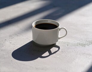 White Coffee Cup On Grey Concrete Surface With Sunlight Shadows
