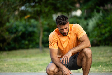 Sports injuries and health problems. Sportsman feeling bad and worried due to the pain.