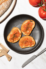 Top view of pan con tomate, tomato toast traditional mediterranean breakfast