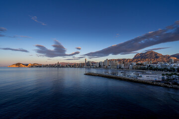Early Morning sunlight illuminates the beach front in Benidorm