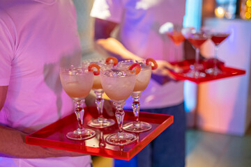 Elegant Cocktails Served on Red Trays at Party Event