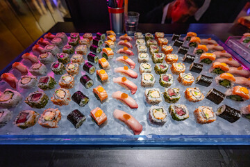 Assorted Sushi Rolls and Nigiri on Ice Display