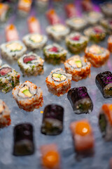 Assorted Sushi Rolls and Nigiri on Ice Display