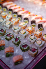 Assorted Sushi Rolls and Nigiri on Ice Display
