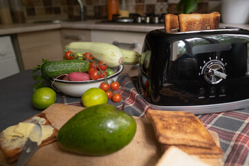 Smoking toast in toaster burnt bread cooking error funny or stressful kitchen moment concept of food preparation gone wrong