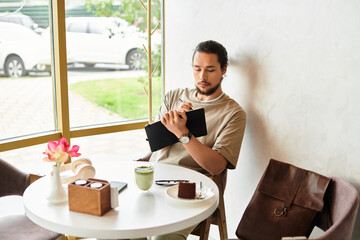 Freelancer enjoys matcha and cake while working remotely in a cozy cafe during summer