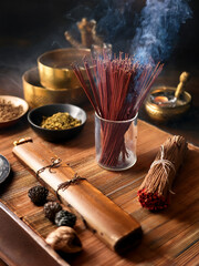 Wellness photography featuring incense sticks and herbal materials in a serene environment.