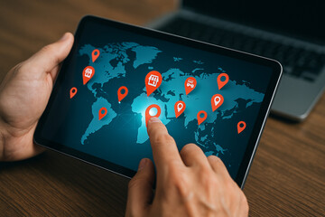 Global business expansion strategy using digital tablet with location pins and world map network system