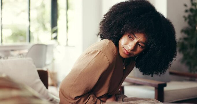 Stomach ache, cramps and woman on sofa in home with menstruation, IBS or constipation. Sick, tummy pain and female person with belly bloating for abdominal problem in living room at apartment.