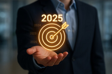 Business man holding target for future success planning and achieving goals in year twenty twenty five