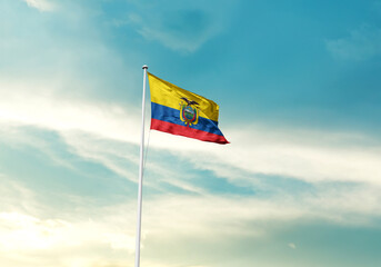 Ecuador flag is waving on a tall flagpole among the clouds. Ecuador national national flag for...