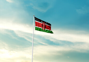 Kenya flag is waving on a tall flagpole among the clouds. Kenya national flag for independence day.
