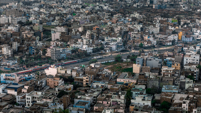 Top down Aerial view of cross traffic highway with cars, trucks aerial. Urban transportation at bridge road at Delhi. Cinematic cityscape of downtown freeway drone shot. Noida Freeway.
