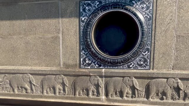 Ancient dravidian architecture with intricate designs and sea backdrop.