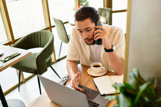 Focused young man engages in remote work while enjoying coffee at a cafe during summer