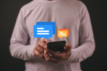 Hand holding smart phone in Social media marketing concept. hand using smartphone typing, chatting...