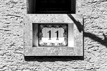 European style house number 11 (eleven) ceramic tile in black and white
