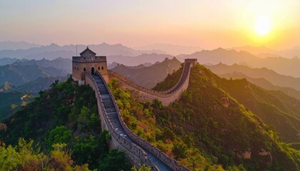 sunset view of the great wall of china winding across mountain peaks with golden light and dramatic sky tones