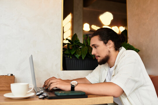 Young man enjoys summer vibes while freelancing at a cozy cafe with coffee