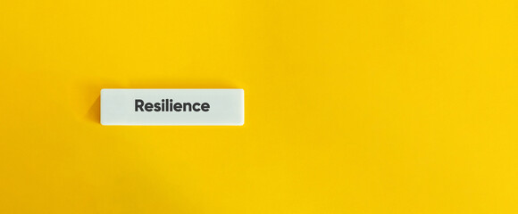 Resilience Concept on Minimal Letter Tile with Yellow Background