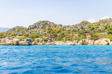 Obraz premium Ruins and turquoise waters of Sunken City of Kekova Island. Island located near Simena between Kas and Demre, Antalya Province of Turkey. Lycian settlement, used by Byzantines too