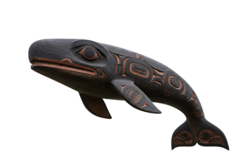 A carved wooden whale styled in indigenous art features dark hues and ornate detailing set against a stark black background