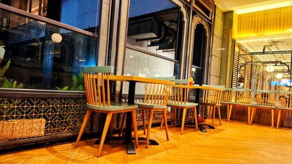 The design concept of a cafe or restaurant with a neat arrangement of chairs, tables and room layout.