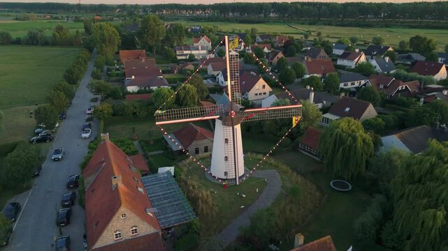 Sunset Reveal Shot Lifting Away from Ramskapelle Windmill | FlyLens 4K
