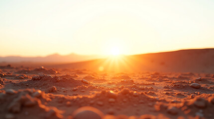 Dramatic sunset with sun rays breaking through clouds over a misty landscape