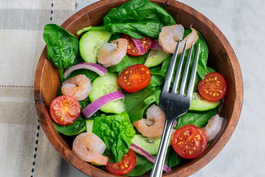 spinach salad top with  shimp