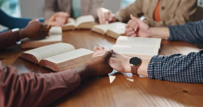 Bible study, group and people holding hands in prayer for spiritual guidance, religion or thankful. Christian community, faith and circle of friends in home with worship, connection and praise Jesus