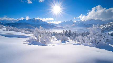 A bright, sunny winter landscape with snow-covered mountains, trees, and a clear blue sky.
