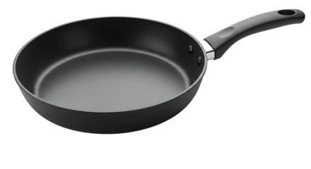 Black frying pan with a curved handle photographed against a black background