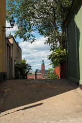 Quiet Stockholm street with old building and green trees