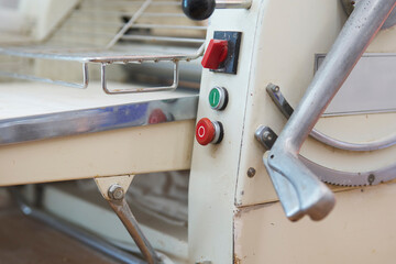 Close up of old fashioned machine for rolling out pastry in bakery