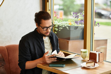 Young man enjoying remote work in a cozy cafe with matcha and cake on a summer day