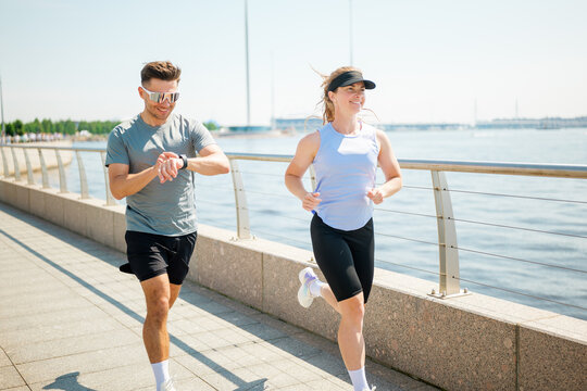 Morning jog along the waterfront brings energy and motivation to active enthusiasts