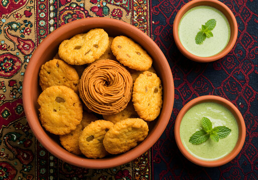 Indian Snacks in Clay Bowl with Mint Chutney | Chakli and Mathri for Festive Celebrations and Food Photography