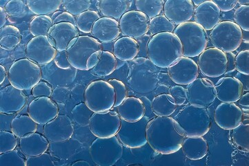 Abstract Blue Soap Bubbles with Light Reflections"