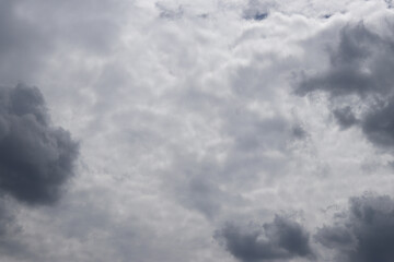 Cloudy sky, sky in gray clouds. Nature background. Weather before rain. Landscape with cloudy sky
