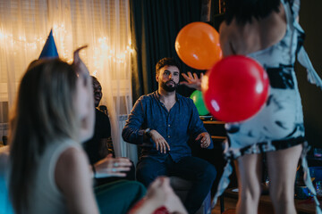 Friends gather indoors for a celebration filled with laughter, balloons, and festive cheer. The...
