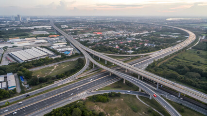 Naklejka premium Aerial view of highway interchange with multiple roads and overpasses for efficient transportation network