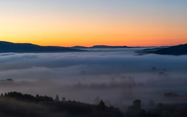 Fototapeta premium Panoramic Sunrise Landscape Misty Mountains and Valley