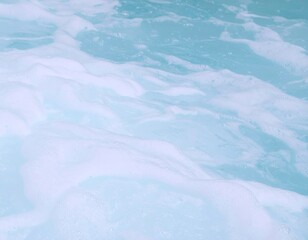 Obraz premium Light blue water with white foam