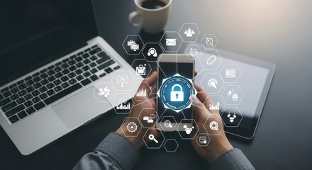 Digital Security: Hands Holding Smartphone with Lock Icon Overlay on Desk with Laptop and Tablet