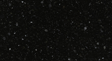 Fototapeta premium Close-up view of a dark speckled surface, resembling a night sky.
