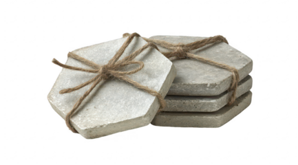 Stacked, hexagonal, light gray stone coasters tied with twine