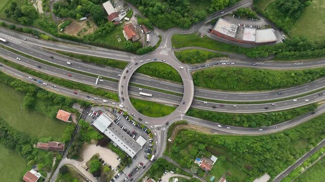 Drone View of Highway Cloverleaf with Circular Overpass and Traffic Flow