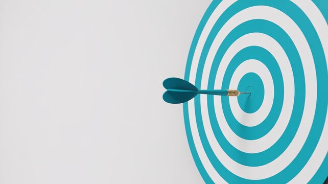 Blue dart hitting bullseye target with copy space. Goal, success, accuracy and focus concept.